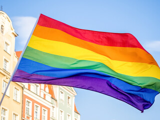 waving rainbow flag outdoor in a sunny day