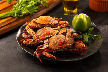 Dish of cooked crabs on the table.