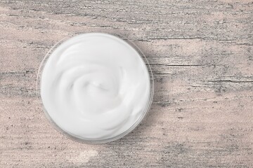 Glass bowl of whipped egg whites and sugar cream