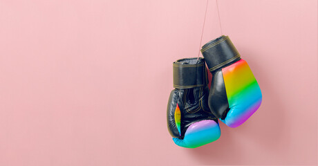 Boxing gloves in the colors of the LGBT rainbow flag. Fight for your rights concept. Template Copy...