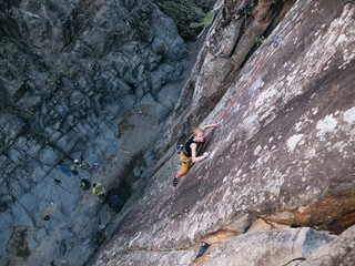 Blond Rock Climbing Girl in Top Rope in Tenerife Canarian Islands