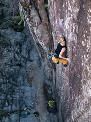 Blond Rock Climbing Girl in Top Rope in Tenerife Canarian Islands