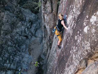 Obraz premium Blond Rock Climbing Girl in Top Rope in Tenerife Canarian Islands