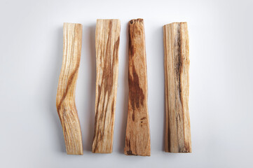 Palo Santo bars close-up and copy space. Ritual cleansing with sacred ibiocai, meditation, aromatherapy with incense and candles..