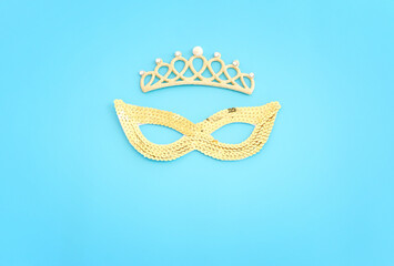 Holidays image of mardi gras masquarade venetian mask over blue background. view from above