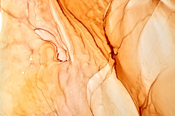 Abstract ocher ink watercolor background. Yellow orange brown paint stains and spots in water, luxury fluid liquid art wallpaper