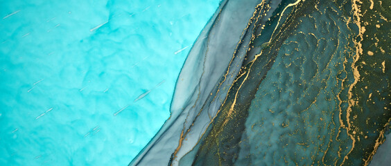 Luxury abstract emerald background in alcohol ink technique, green gold liquid painting, scattered...