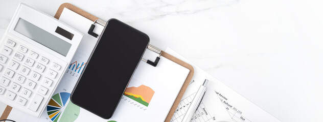 Concept of annual summary review with smart phone and report.