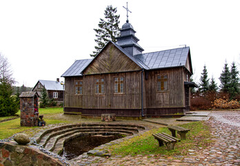 Built in 1884, a historic wooden Roman Catholic chapel with a spring in the village of Hodyszewo in Podlasie, Poland.