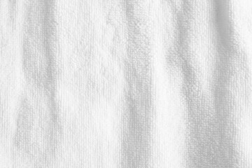 Fototapeta na wymiar White towel background. Soft fabric texture backdrop. Fluffy blanket. Clean cotton.