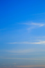 Vertical image white clouds in blue sky in the morning.