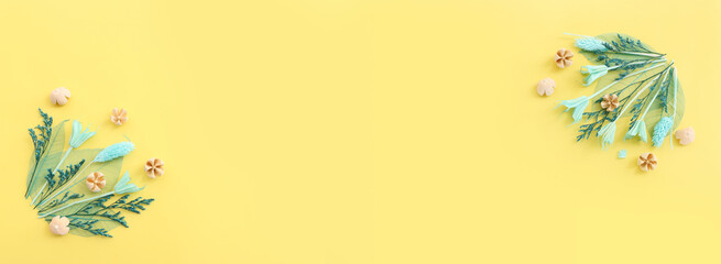 Top view image of autumn forest natural composition over yellow background .Flat lay