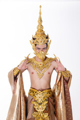 Half body portrait of 20s asian man wear gold leaf foil and golden dress of National costume