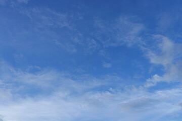 Bright blue sky and soft cloud.