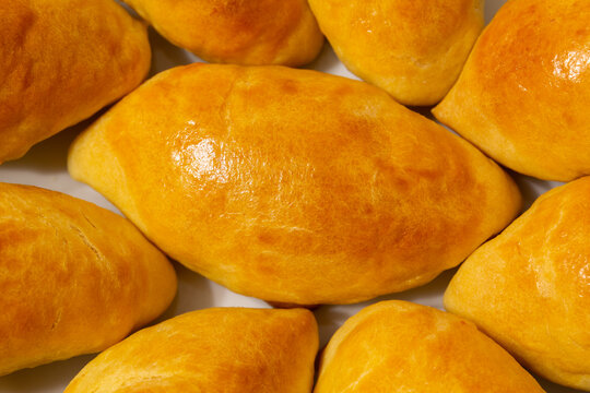Traditional turkish breakfast savory pastry food close-up top view. It is known as Poaca or Poğa&ccedil;a in Turkish. It is a very popular breakfast food. Cheese, olives, sausage can be put inside.