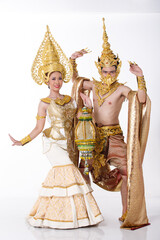 Full length two couple portrait of 20s asian woman man wear gold leaf foil and golden dress