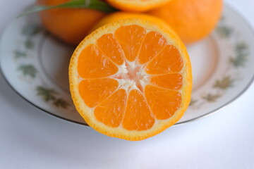 ripe and juicy tangerine (mandarin). cutaway tangerine fruit on a white background.