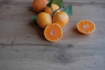 ripe and juicy tangerine (mandarin). cutaway tangerine fruit on a gray background.