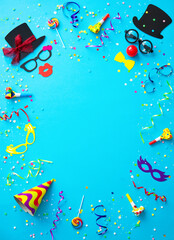 Colorful carnival or birthday party background with streamers, confetti and funny faces