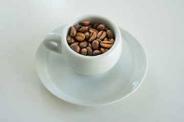 a small coffee in a white cup