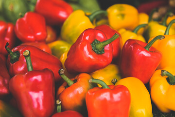 Group of red and yellow bell peppers.
