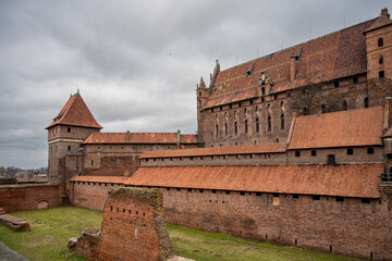 The medieval Castle of the Teutonic Order in Malbork in the Pomerania region, Poland. This is the largest castle in the world measured by land area and a UNESCO World Heritage Site