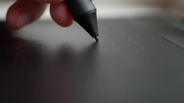 Drawing with pen on tablet close up. Digital illustrator occupation. Online signature 4k video
