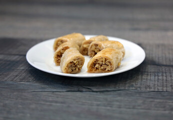 A white plate full of freshly baked Lebanese baklawa.