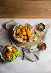 Naklejka premium vegan chicken nuggets on a table with sides