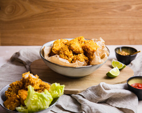 Vegan Chicken Nuggets On A Table With Sides