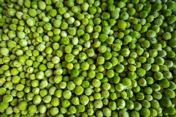 Fototapeta na wymiar frozen frosty green peas background closeup