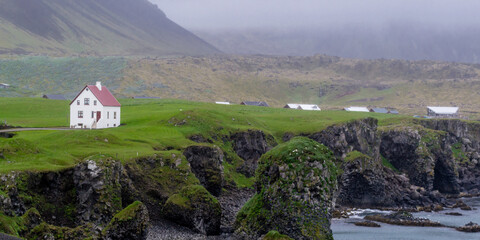 House by the shore in small fishing village Arnarstapi in Sn&aelig;fellsj&ouml;kull National Park at Snaefellsnes Peninsula, Iceland