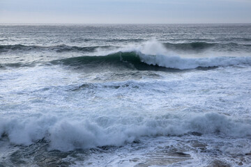 Waves crash in from Atlantic swells at Chapel Porth beach, Cornwall
