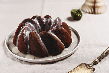 Pumpkin tangerine bundt cake with pumpkin spice and nuts for winter dinner. Christmas. Selective focus