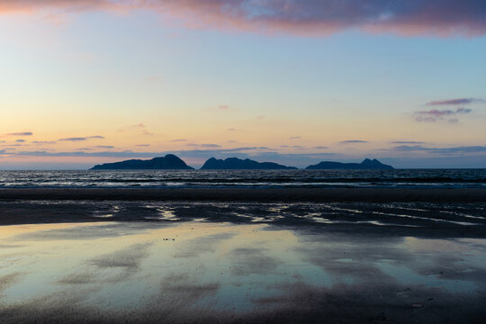 View of the Cies islands at sunset from the beach in Nigran, Galicia, Spain