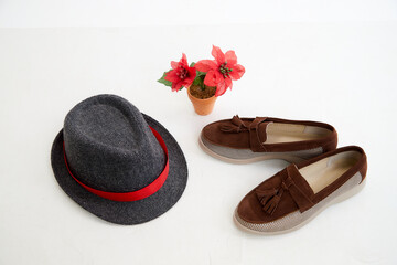 Brown beautiful fashionable female loafers shoes. Studio shoot on white background for a magazine, website in Internet or catalog