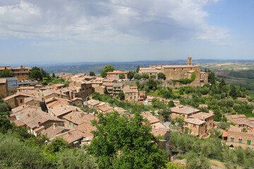 Fototapeta na wymiar The view on the historic city of Montalcino in Tuscany, Italy, high on the hill above the rural Tuscan countryside. 