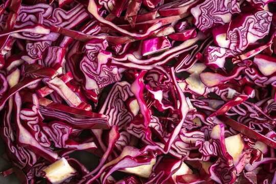 cut purple cabbage slices closeup background