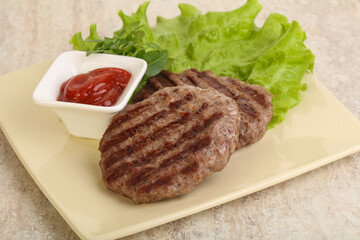 Grilled beef burger cutlet with sauce