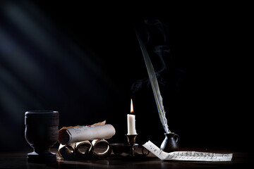 Medieval quill, candle and letter