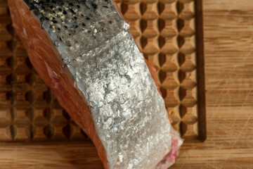 raw salmon filets with herbs and spices on baking tray