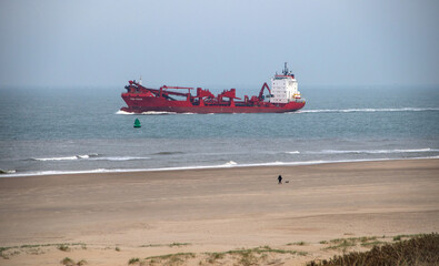 Huge ship passing the beach