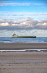 Huge ship passing the beach