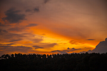 Sailing boat during sunset at Promthep Cape in Phuket peninsula, Thailand