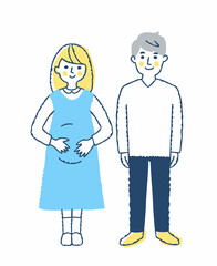 笑顔で立っている妊婦とパートナーの男性