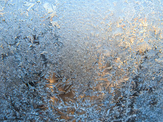 Winter frozen window covered with ice crystals