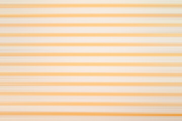 Obraz premium Straight horizontal orange stripes on beige backdrop