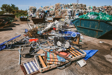 Stack of different types of garbage at city dump
