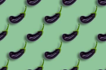Purple and green eggplant pattern on light green background. Aubergines for wallpapers
