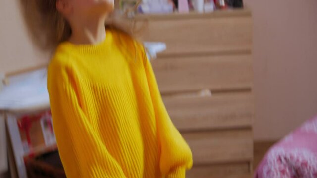 Girl flapping hair indoors closeup